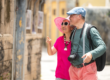 Tourist couple exploring a historic street in Torres Vedras